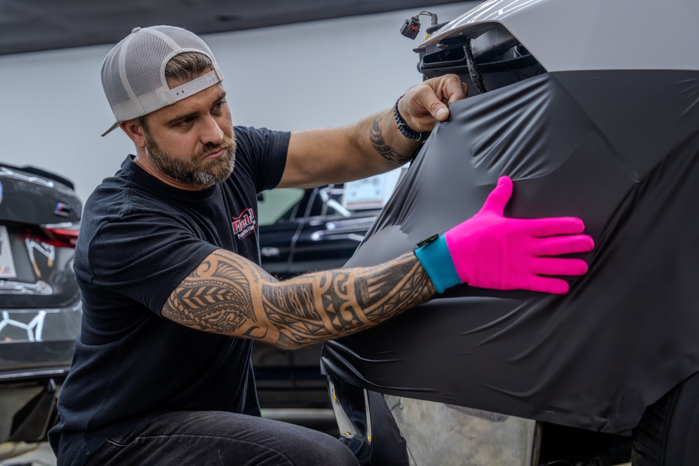 Installer applying paint protection film